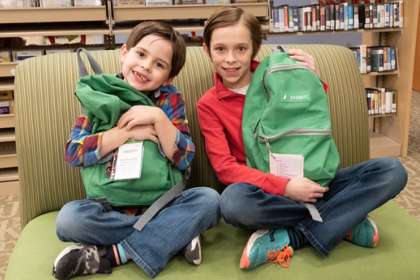 Two boys with nature backpacks