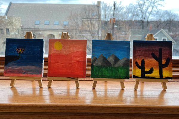 Four tiny art canvases