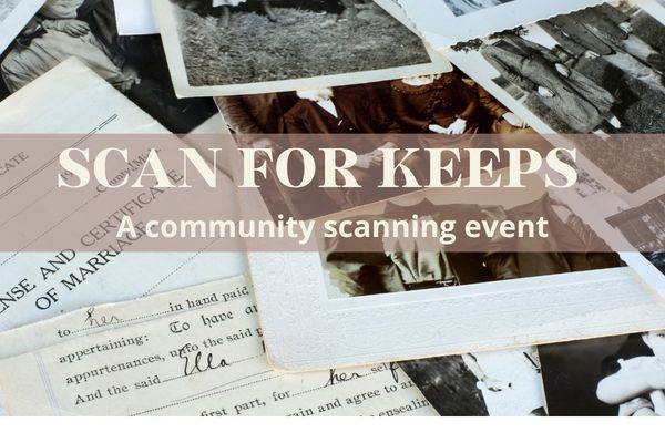 old photos and documents spread out on table but overlapping