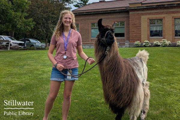 Teen with Llama on library lawn
